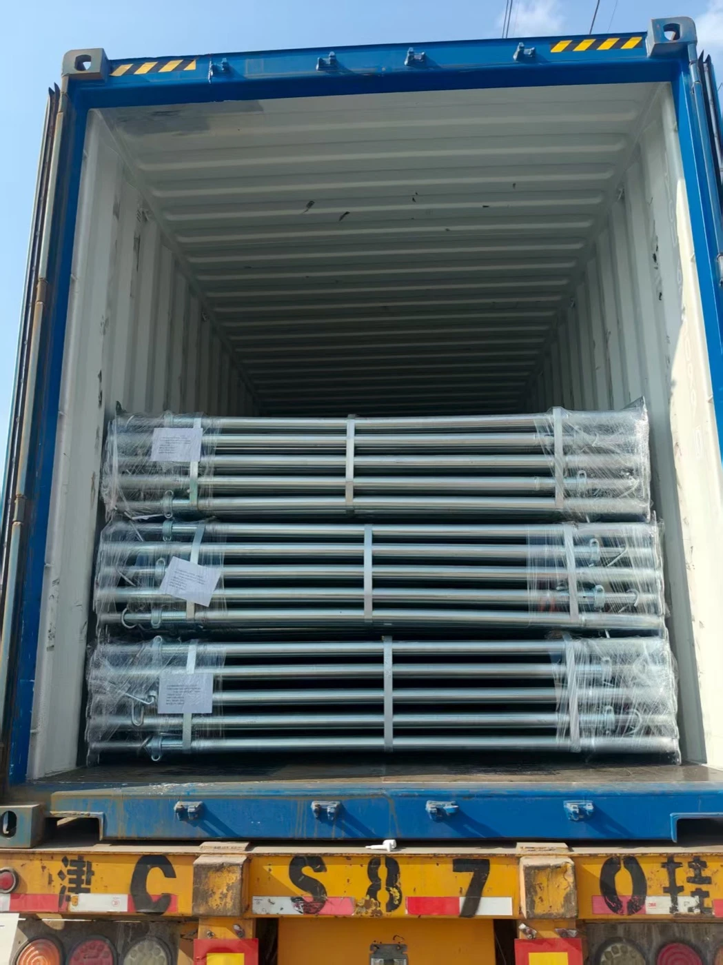 Bundled steel props in container